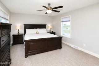 Primary bedroom photographed for a Clifton Park real estate listing